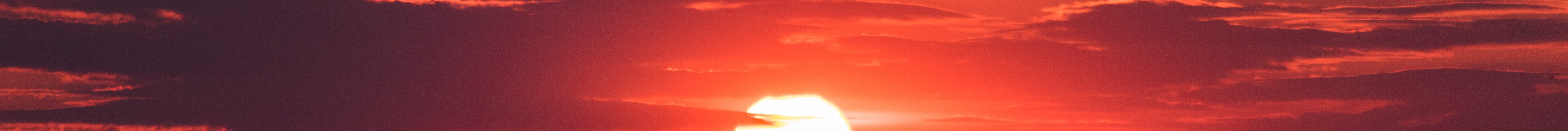 A blood red sunset. Photo by Jason Blackeye at Unsplash.